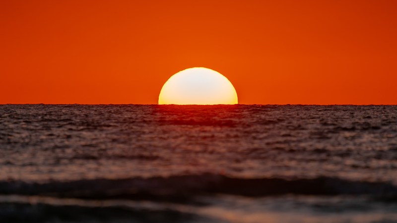 A photo of the setting sun. The debate over solar geoengineering is heating up.
